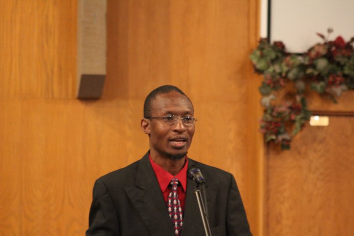 Elder Micah sharing a message.